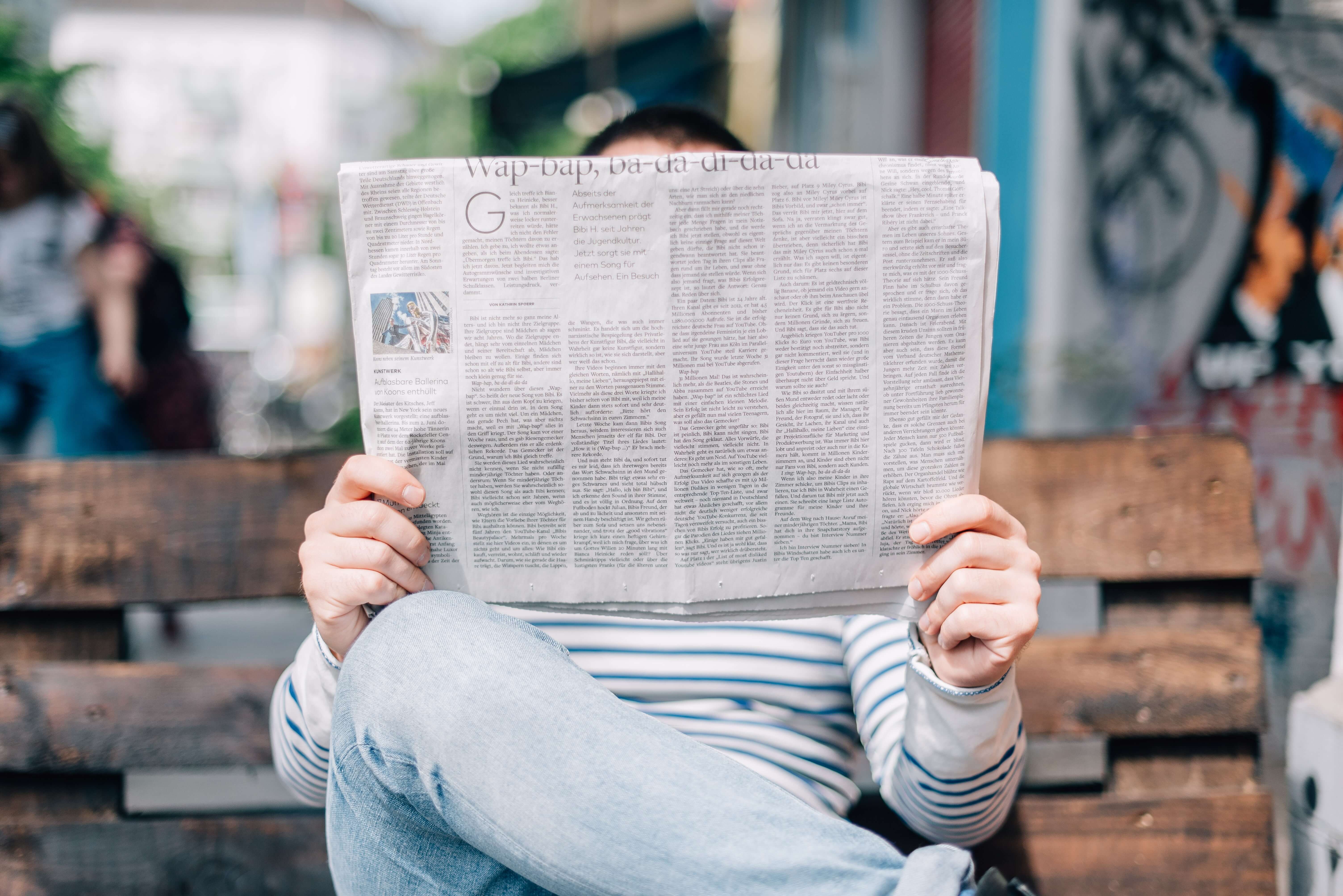 man reading a magazine